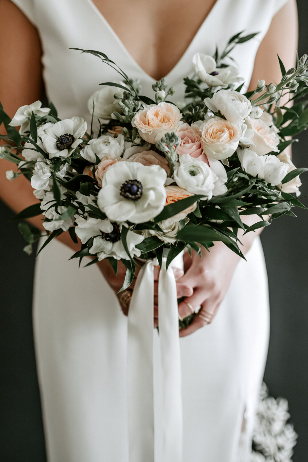 The white anemone is such a pretty flower, and its dark centre adds drama to this otherwise soft bridal bouquet. - Floral Design: Creative Edge Flowers // Planning: CNC Event Design // Photography: Grey Lily Photography // Venue: Studio 1130 // Rentals: Modern Rentals / Great Events Rentals // Gown: Blush & Raven // Hair: Hair Design by Jess // Makeup: Christina Polischuk // Cake Artistry: Modern Bake // Jewellery: au+c fine jewelry // Stationary: The Social Page Design Studio